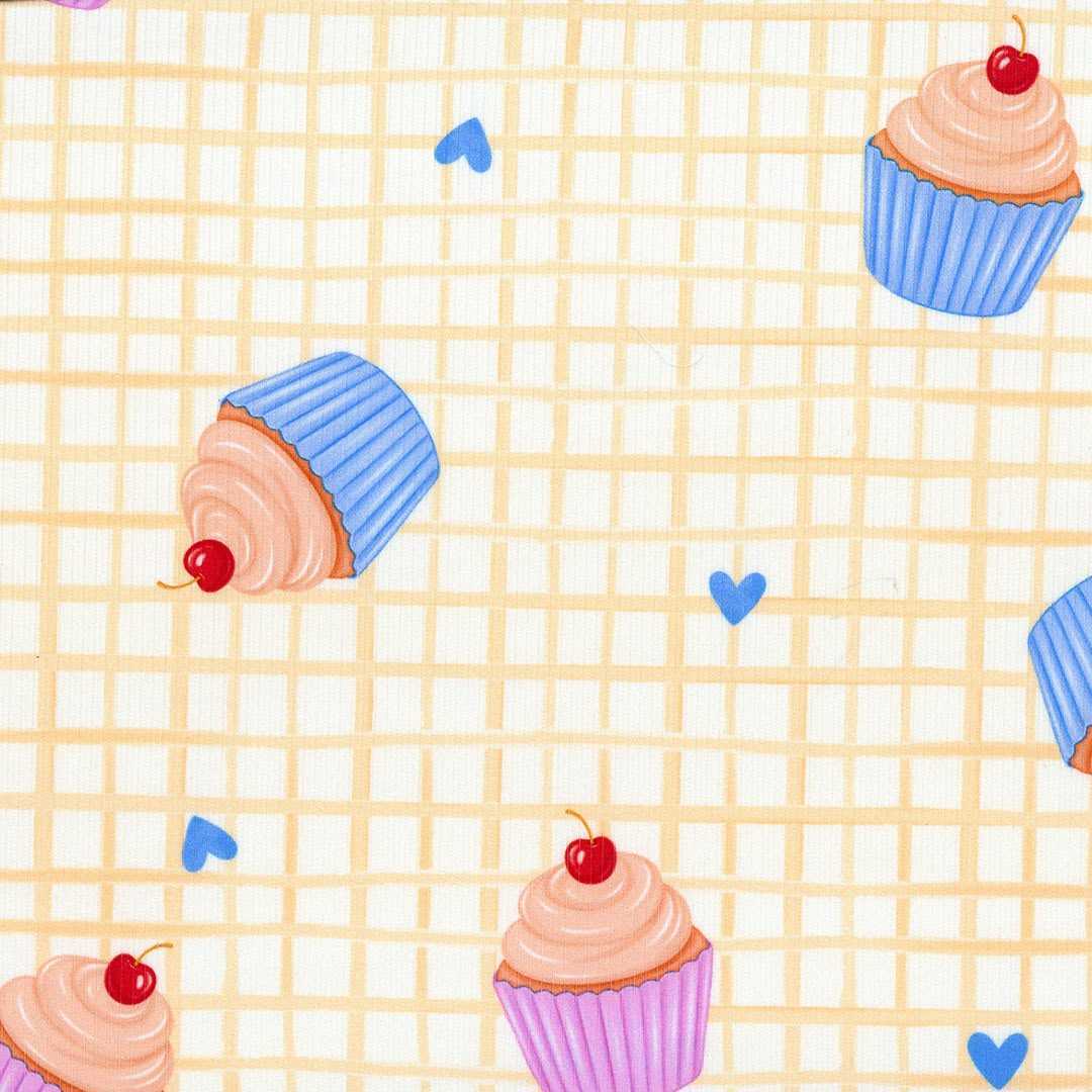 Tela con estampado de cupcakes y dulces